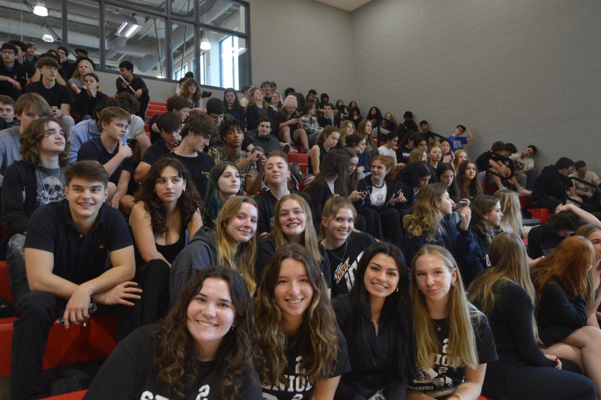 Seniors smile in support of their friends playing in the basketball game. (Photo by Tessa Kassoff)