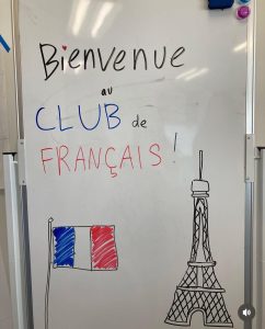 The leadership team set up a welcoming whiteboard for the clubs new members.
(Photo via meridianfrench_club)
