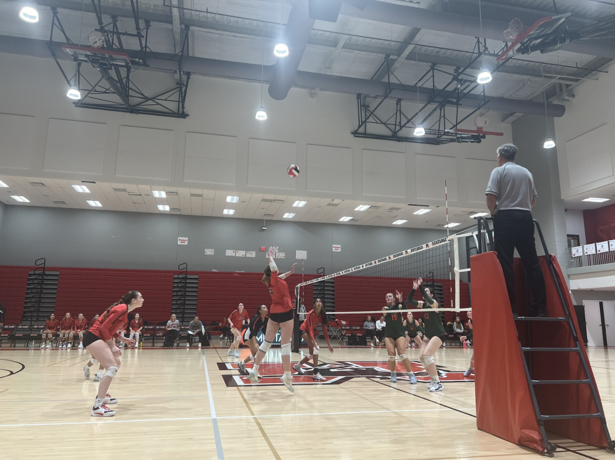  Sophomore Maddelyn Denny spikes the ball against Kettle Run (Photo by Monroe Duff).