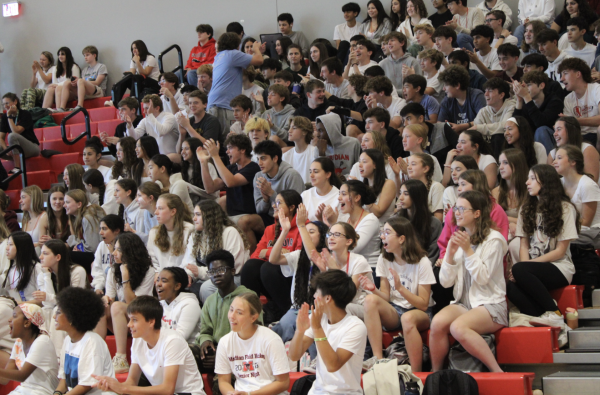 The sophomores cheer on their rock-paper-scissors representative to go against the other grades. (Photo by Tessa Kassoff)
