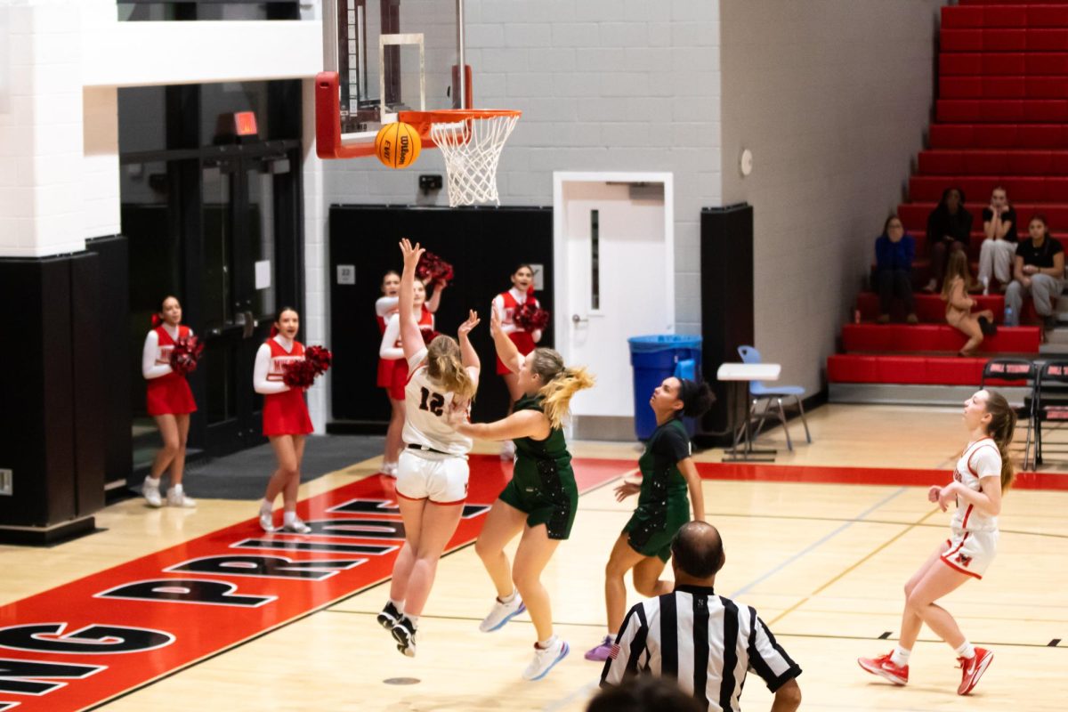 Junior Zoe Gale shoots a layup. (Photo by Ryan Degnan)