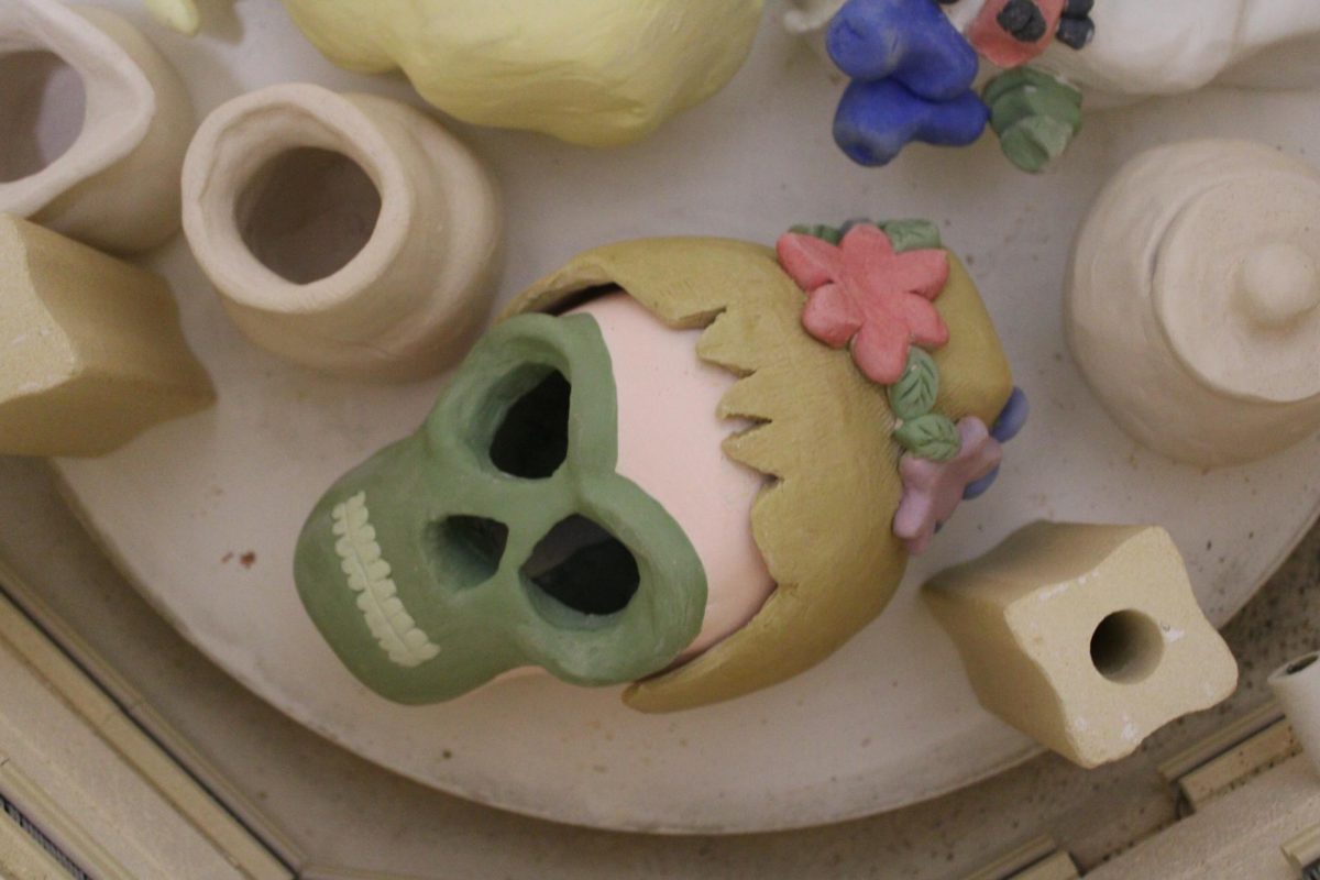 Freshman Sherlyn Gideon’s skull project depicts Tinkerbell, shown with a blonde bun, green outfit, and a beautiful flower crown (Photo by Emily Johnson)