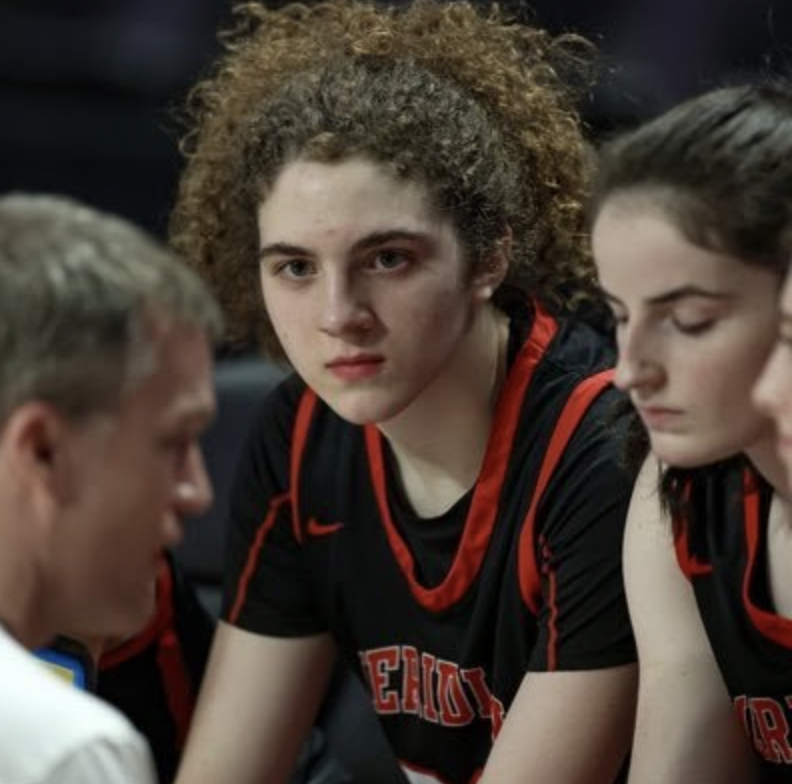 Nora Stufft wearing her basketball jersey during the state championship. (Photo via Twitter)