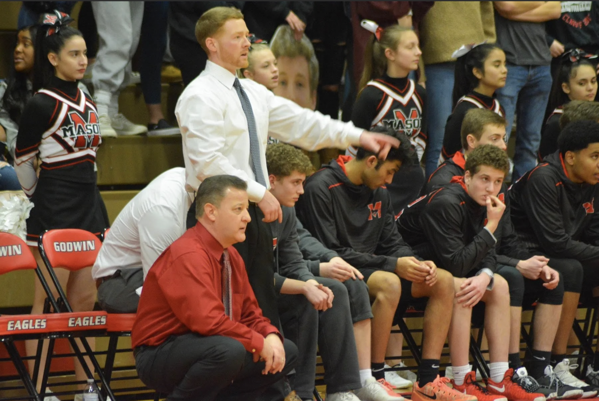 Coach Cap coaching with Coach Gilroy during a game (Photo via the Falls Church News Press)