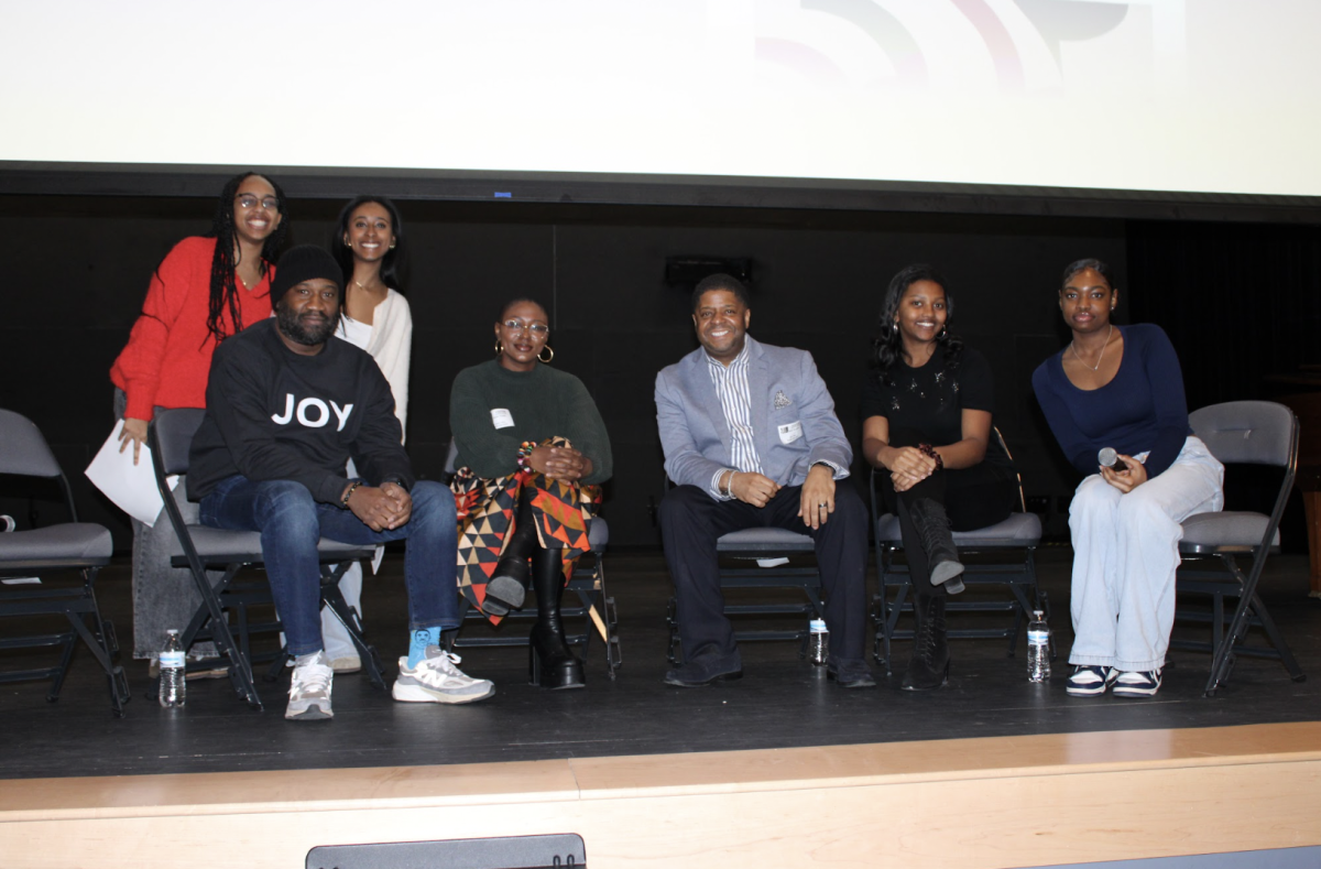 Associated speakers featured on the panel pose for a photo with members of the Meridian BSU. (Photo by Tessa Dunn)