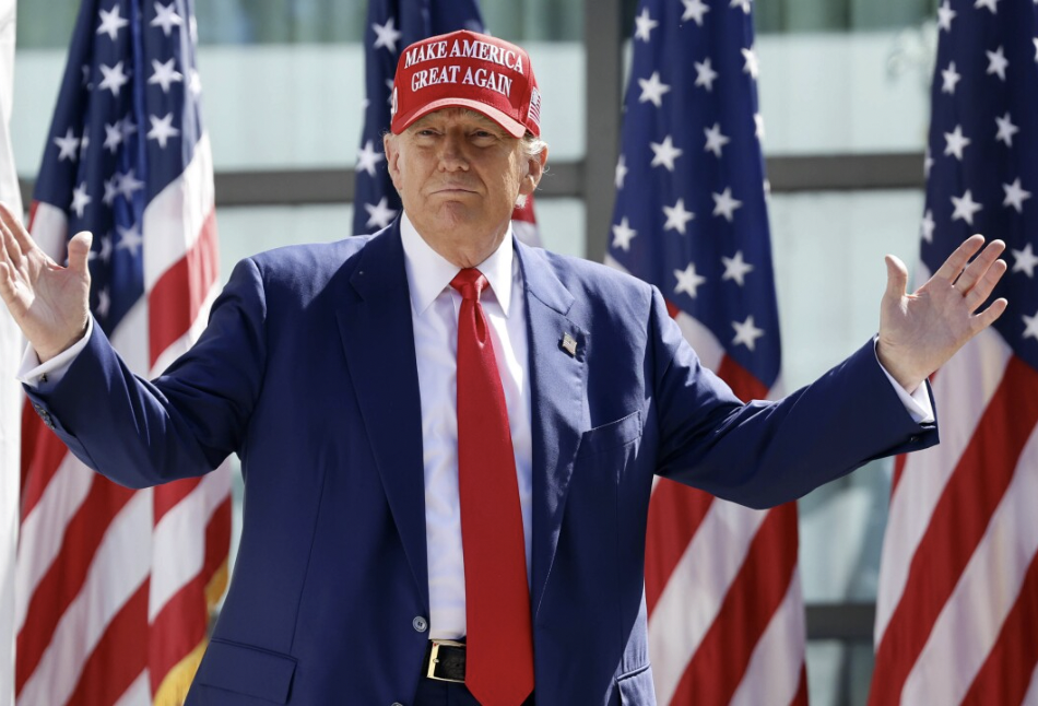 President Trump wearing his signature campaign hat, “Make America Great Again.” (Photo via 10News)