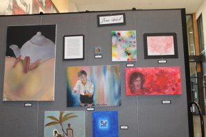 Senior Zaria Scholl’s IB artwork display features different creative styles. (Photo by Emily Johnson)