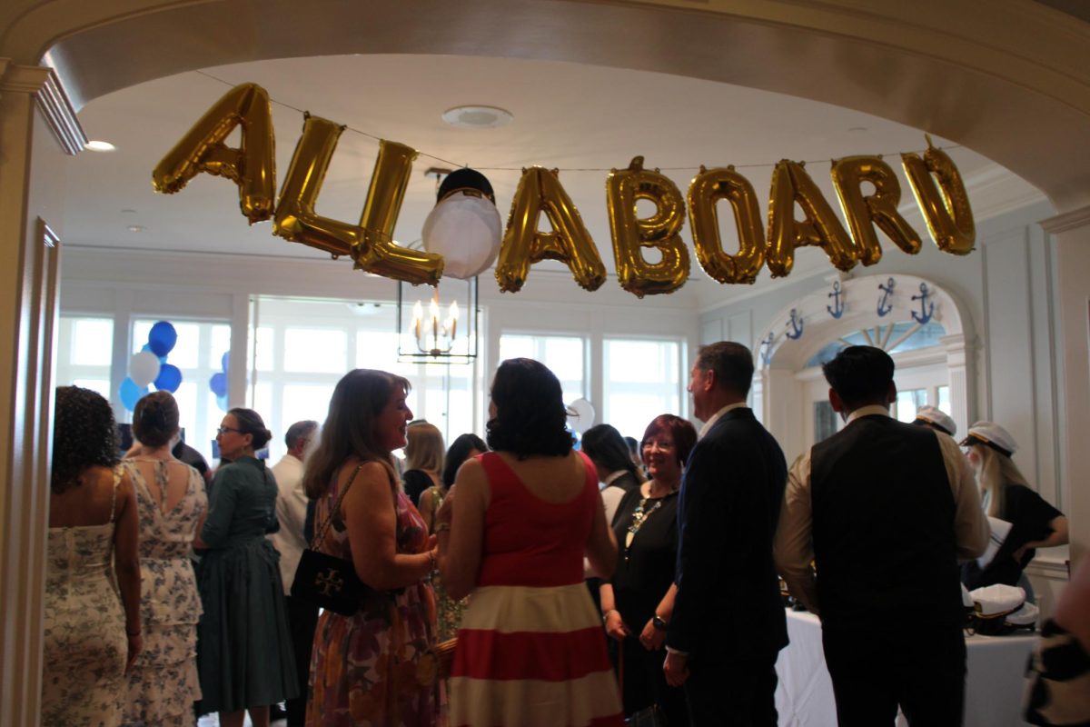 Entering the main room, the words “All Aboard” adorn the entryway, providing a ship-like feel. (Photo by Tessa Kassoff)
