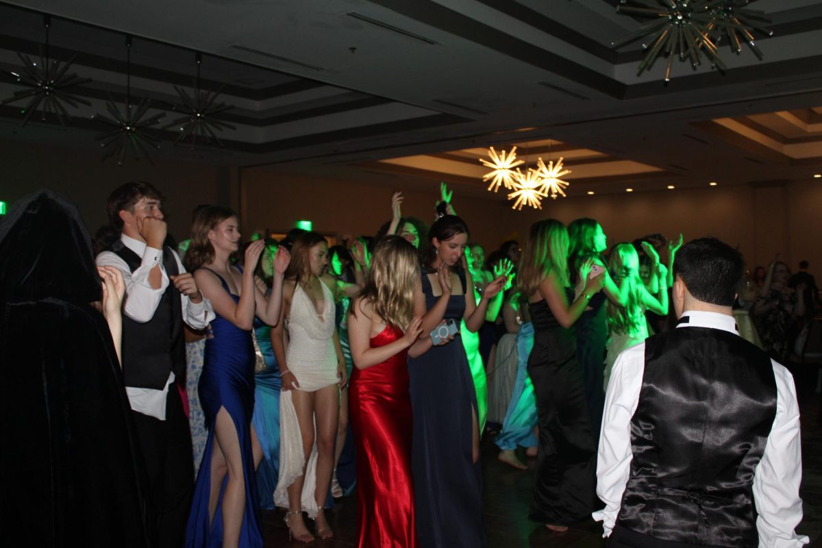  Students dance to the music at prom. (Photo by Emily Johnson)