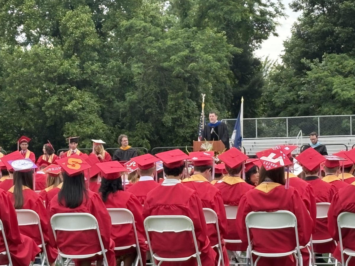 Graduates listen to Dr. Noonan’s farewell speech. (Photo by Layla Kozbelt)