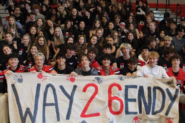 Meridian's senior class poses for a photo with their banner. (Photo by Camilla Contreras)