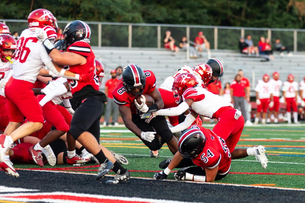 Senior Oumar Thompson scores his first touchdown. (By Ryan Degnan)