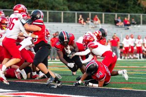 Senior Oumar Thompson scores his first touchdown. (By Ryan Degnan)