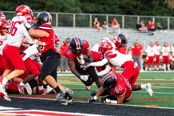 Senior Oumar Thompson scores his first touchdown. (By Ryan Degnan)