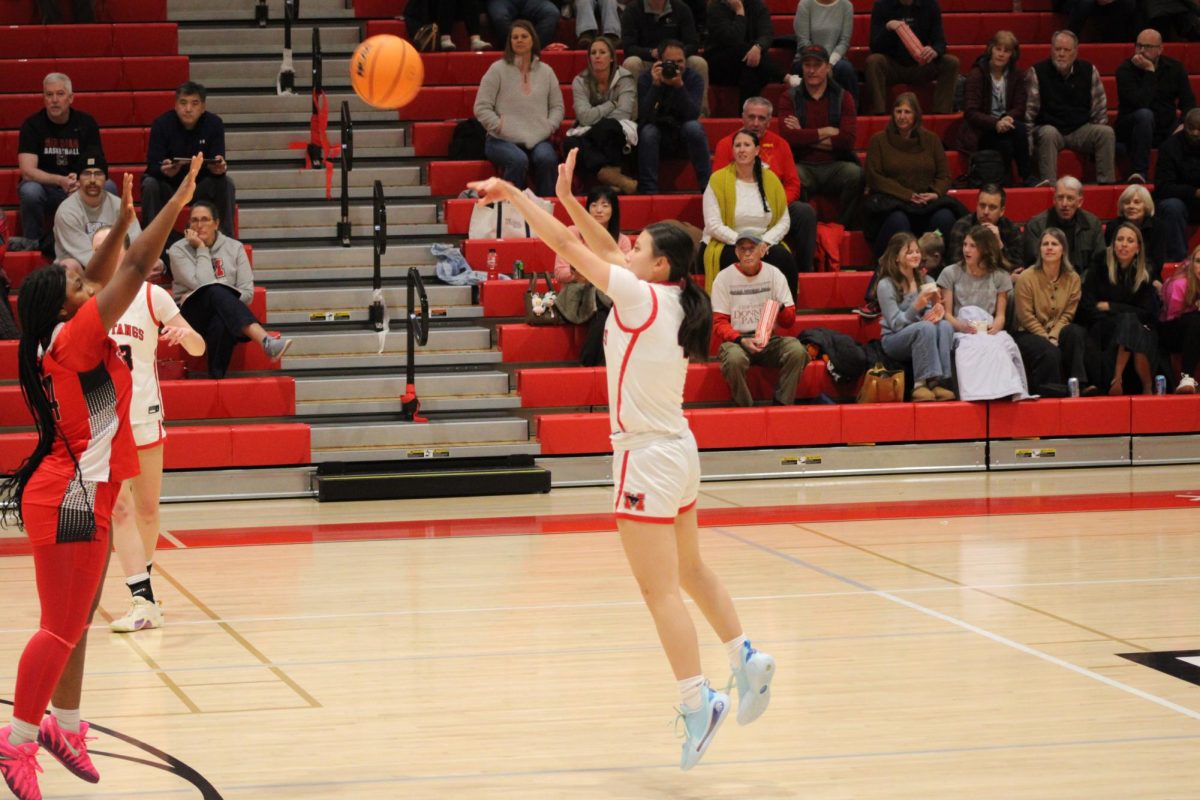 Junior Charlotte Lieu #4 shoots, and makes a 3-pointer in the 3rd quarter. (Photo by Nathaniel Landers)