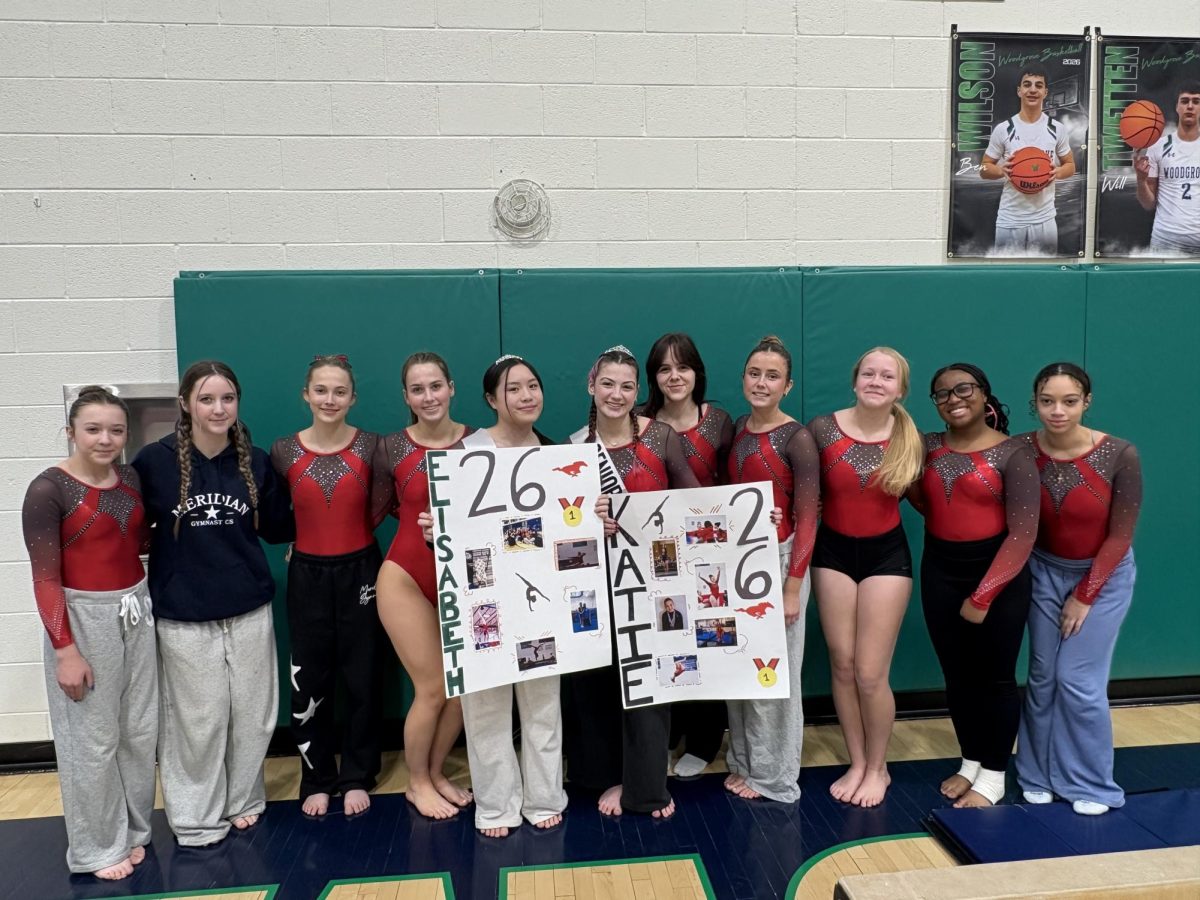 The Gymnastics team celebrating their seniors at Regionals. (Photo courtesy of Rebecca Degnan)