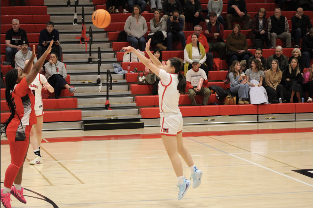  Junior Charlotte Lieu (#4) shoots and makes a 3-pointer. (Photo by Nathaniel Landers)