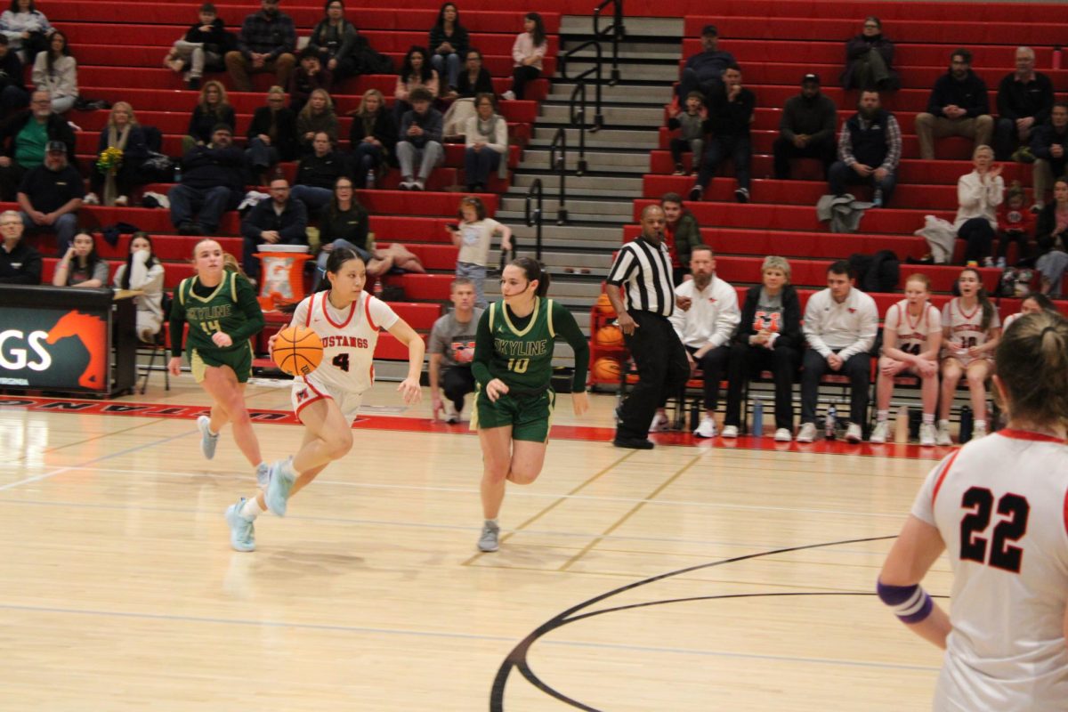 Junior Charlotte Lieu (#4) dribbles past the Skyline defensive line (Photo by Liliane Bonnenfant)