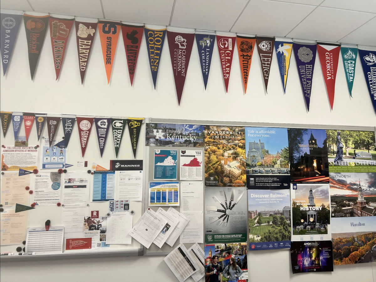  College banners and flyers hang from Ms. Mural’s office. (Photo by Madeleine Kim)