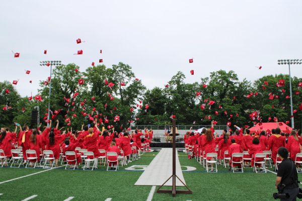 The Class of 2026 throw their caps in the air after officially graduating.